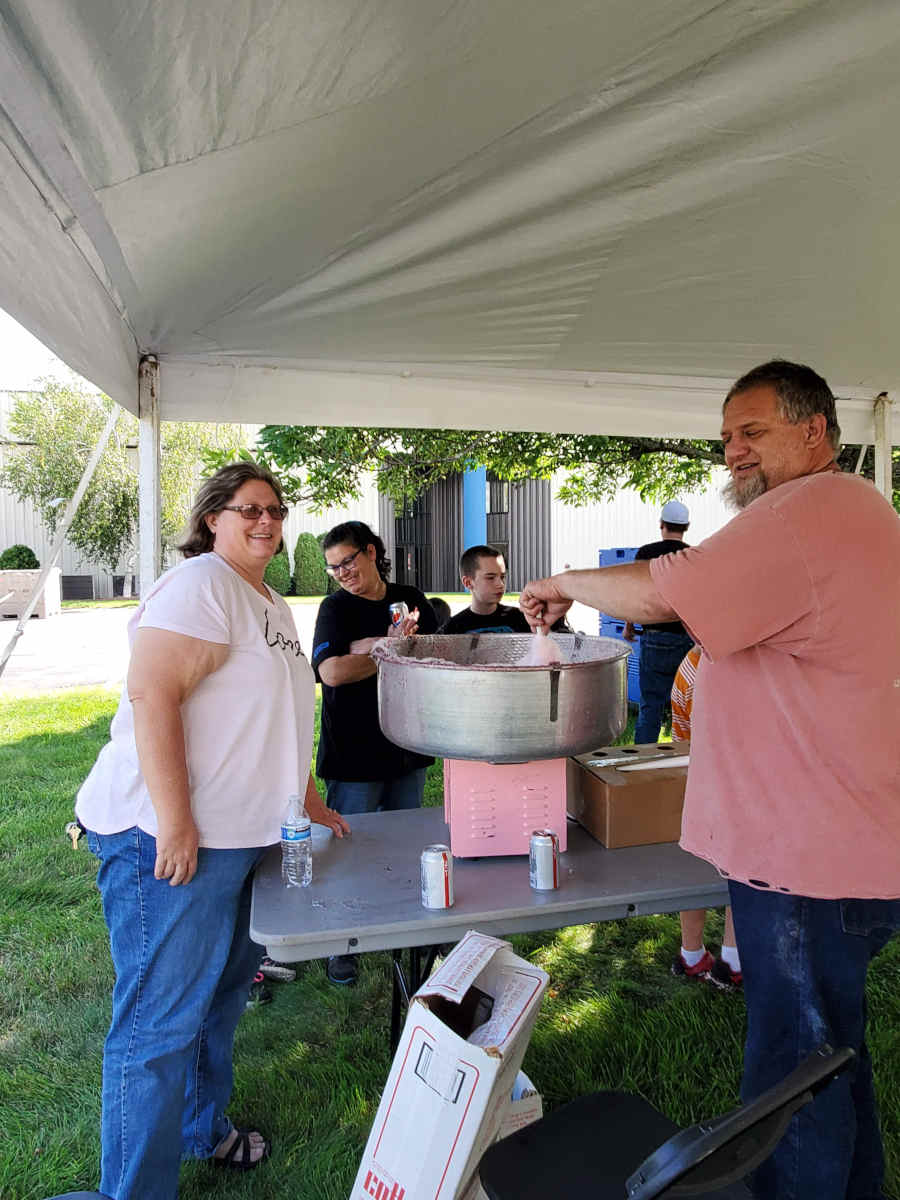 Folks about to enjoy some fresh spun cotton candy