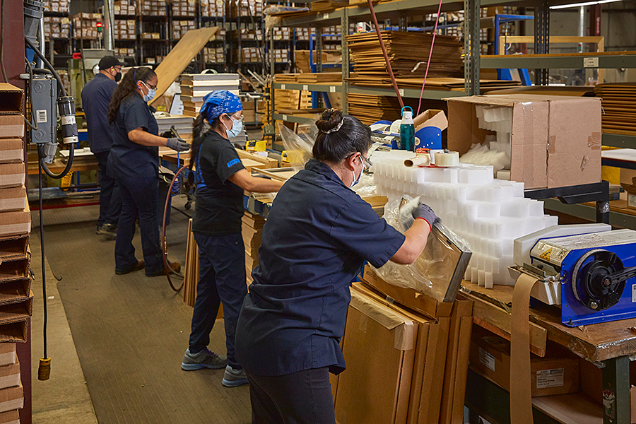 Workers on assembly line