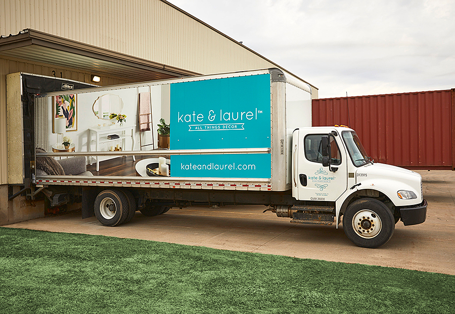 kate & laurel branded truck at warehouse