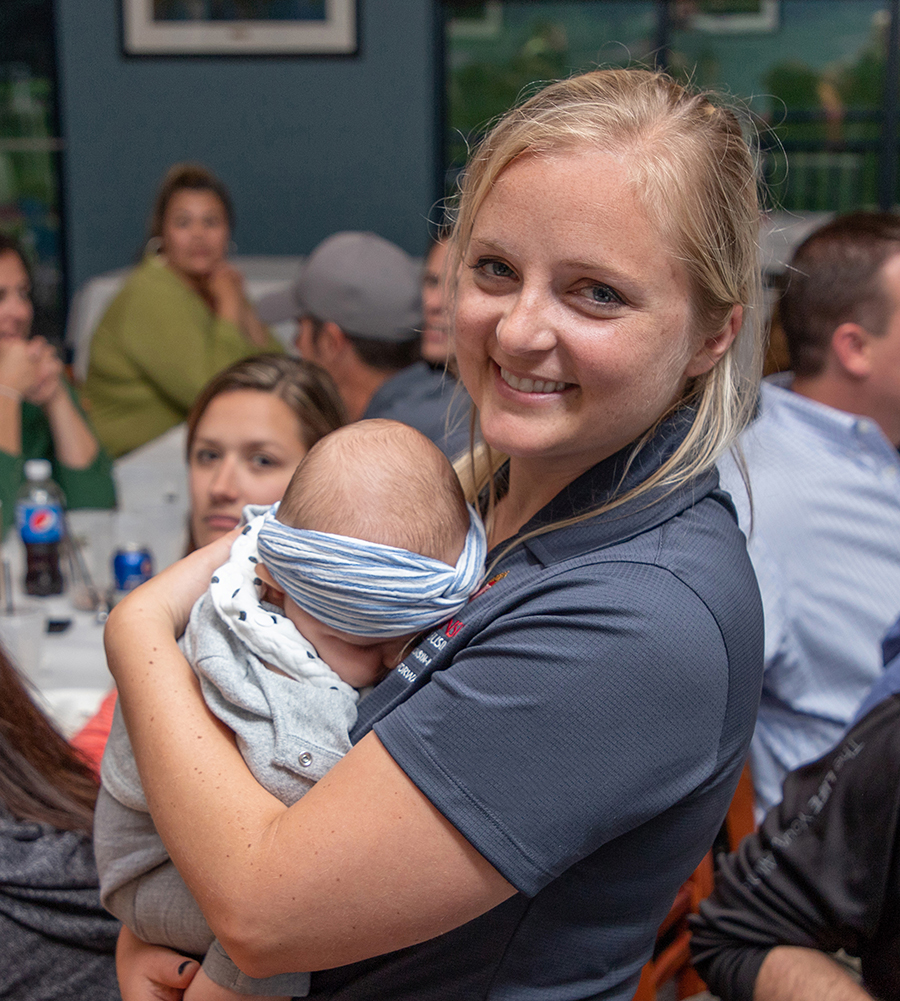 Person holding very small person